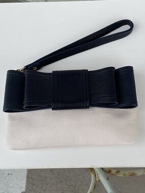 kate spade Cream Wristlet with Navy Bow